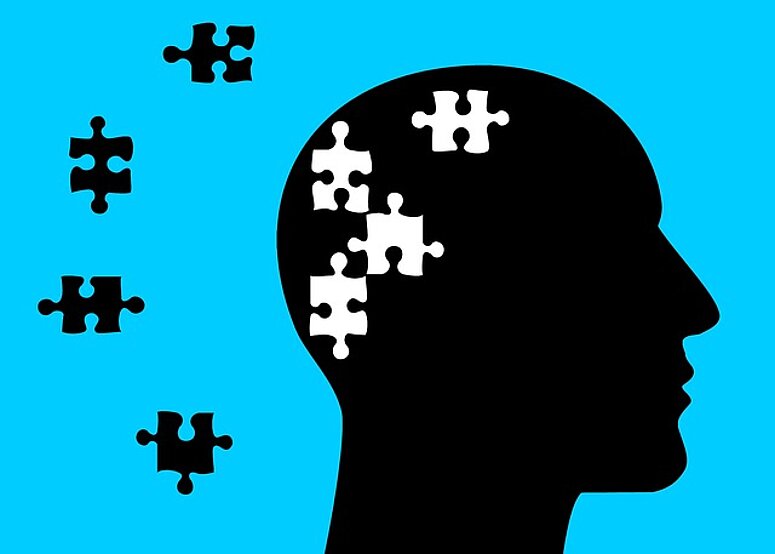 hoofd met ontbrekende puzzelstukjes